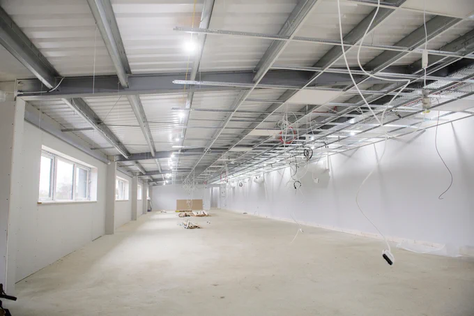 The activity space is taking shape with windows installed.