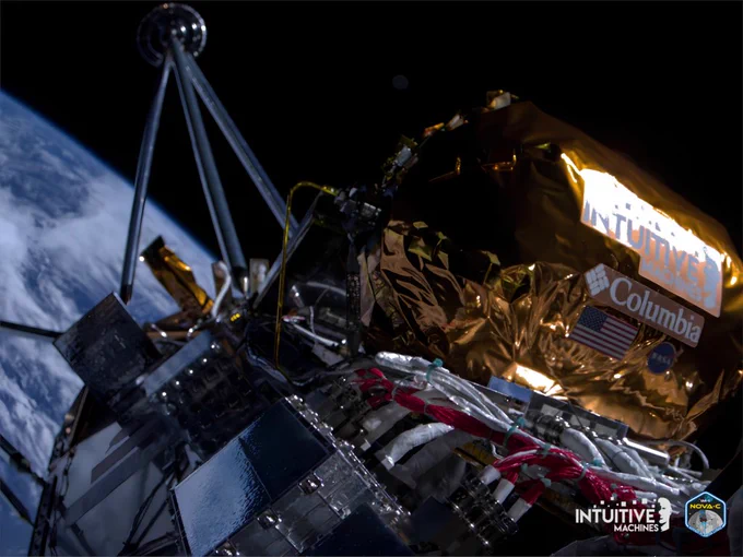 A view of Earth and one of Odysseus’ fuel pressurant tanks aboard the IM-1 mission. The Intuitive Machines lander takes up most of the image, while Earth's blue water and white clouds are in the background. The lander has a mostly metal surface. Red and white cables tied together with green zip ties and a gold metal tank are at bottom right. The logos of Intuitive Machines, Columbia, and NASA, as well as the American flag, are on the gold portion. Credit: Intuitive Machines