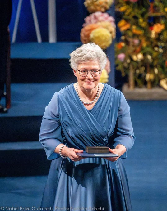 Anne L’Huillier receiving her Nobel Prize on stage in Stockholm, Sweden. 