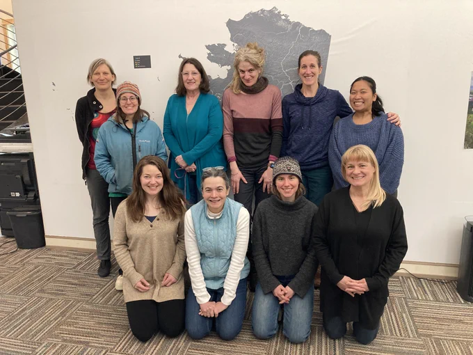 A group of women pose together.