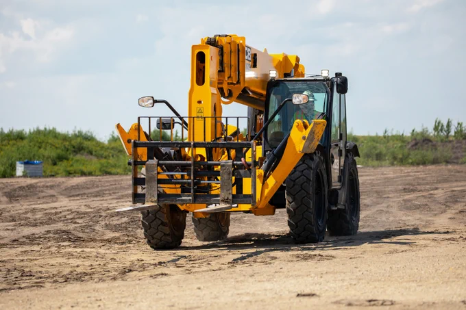 Forklift driving on construction site