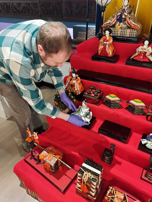 Ross is adding the Hina Matsuri dolls to the stage.
