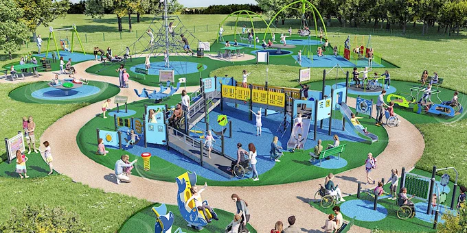 Photo of an accessible playground with ramps and wide wheelchair accessible paths