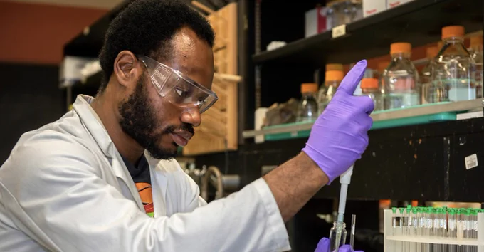 Student conducting research in a lab.