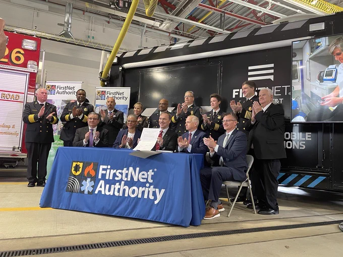 Public safety from Fairfax County stands behind Richard Carrizzo, Renee Gordon, Joe Wassel, Jim Bugel, and Scott Agnew as they sign a commitment ot Public Safety