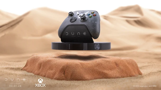 Image of a custom Dune Part Two Xbox Controller and stand floating above a mound of sand in a desert environment. The Dune Part Two logo as well as “Only in Theaters 03.01.24” and the Xbox logo is in the bottom left corner and “©2024 Legendary and WBEI” is in the right corner.