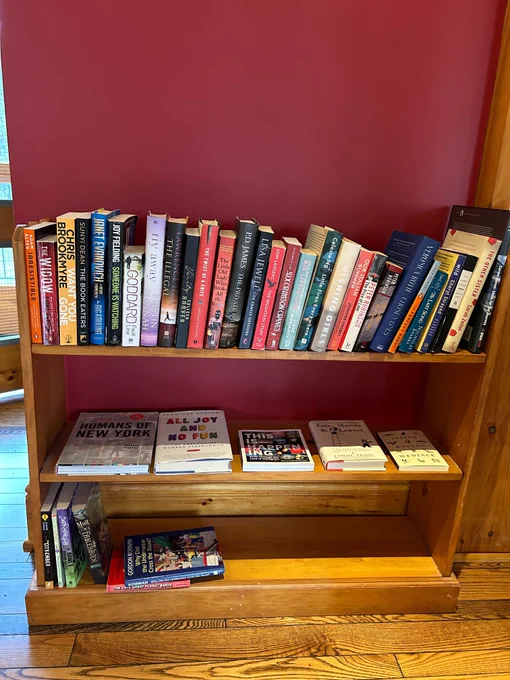 A shelf filled with books inside an office