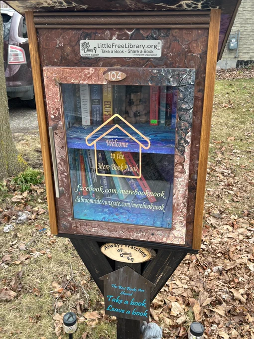 A Little Free Library on a front lawn