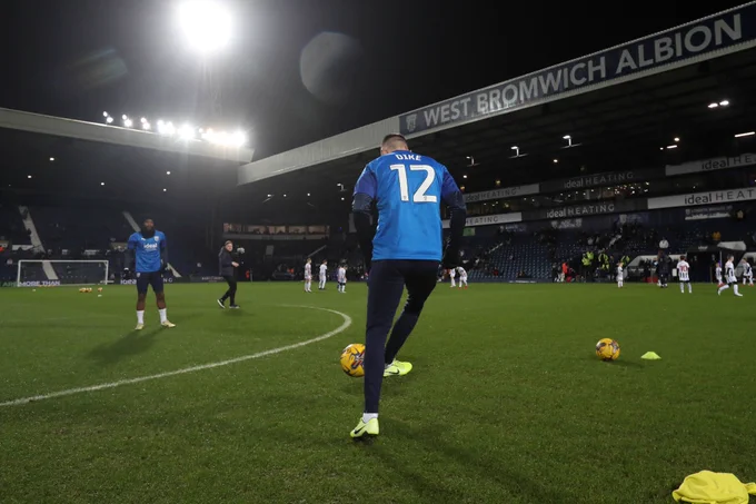 Albion players warm up in Daryl Dike shirts, after his serious Achilles injury against Ipswich Town.