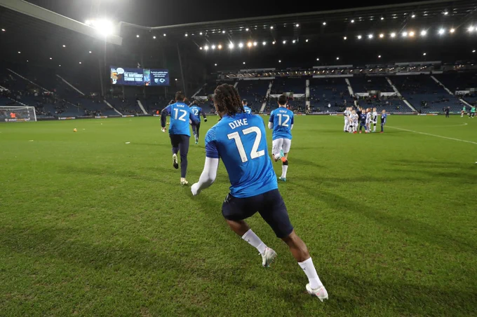 Albion players warm up in Daryl Dike shirts, after his serious Achilles injury against Ipswich Town.