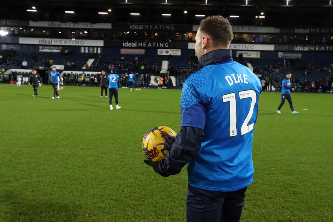 Albion players warm up in Daryl Dike shirts, after his serious Achilles injury against Ipswich Town.