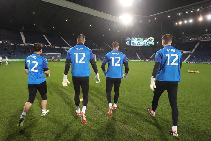 Albion players warm up in Daryl Dike shirts, after his serious Achilles injury against Ipswich Town.