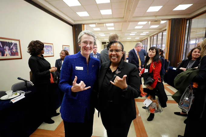 President Wilson of UTEP and Dr. Berhe of the Department of Energy's Office of Science give the UTEP picks up sign.