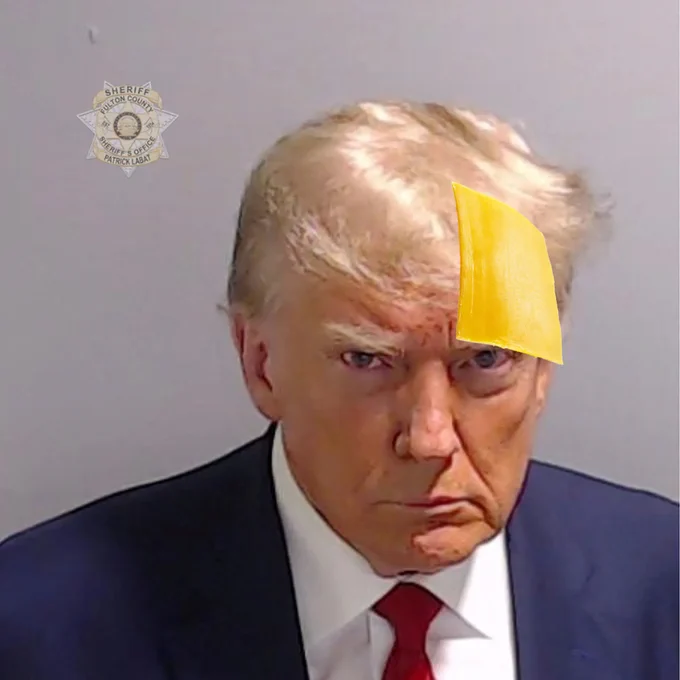 Trump gets hit with a slice of american cheese.
