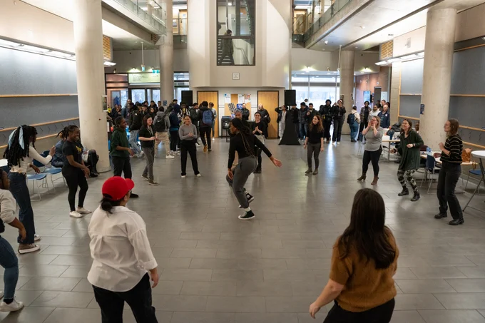 University community members practicing their new dance routine.