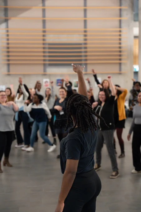 Afiwi Groove dance instructor showing a group of Ontario Tech students, faculty and staff some new moves in the Founding Dean’s Atrium.