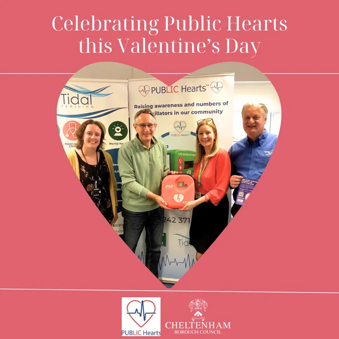Graphic with red love heart and image of Cheltenham Borough Council employee and cllr, with Tidal Training employees - holding a new defibrillator.
Text: Celebrating Public Hearts this Valentine's Day