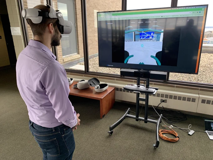 A person with a virtual reality headset on playing a game