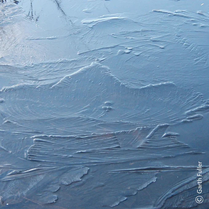 Close up of cracking ice.