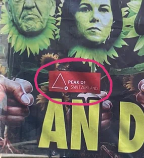 Detail mit Logo "Peak of Switzerland" auf Menschen-als-Unkraut-Vernichtungsplakat
