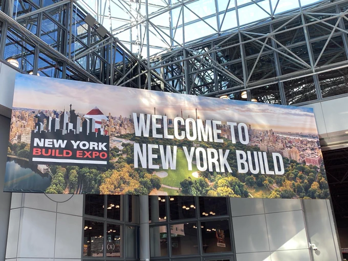 Exhibitor at New York Build Expo 2024, Luminous Egress helps owners and builders plan and install photoluminescent egress systems for safer emergency exit routes. Photo of New York Build hall entry marquis by Luminous Egress.