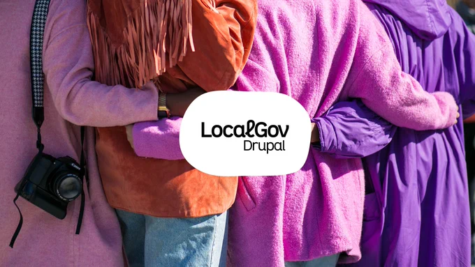 A photograph features four individuals in partial view with their arms crossed, showcasing a sense of unity or teamwork. The visible attire includes a brown jacket with fringes and a camera strap, and various shades of purple clothing. The central focus is a speech bubble with the text 'LocalGov Drupal', signifying a promotional or informational context related to the LocalGov Drupal community or services.