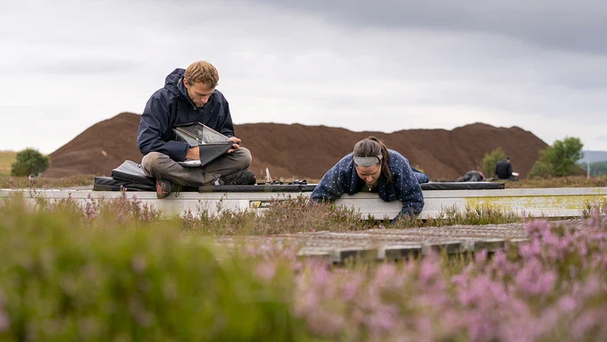 Two UKCEH researchers assessing peatland vegetation