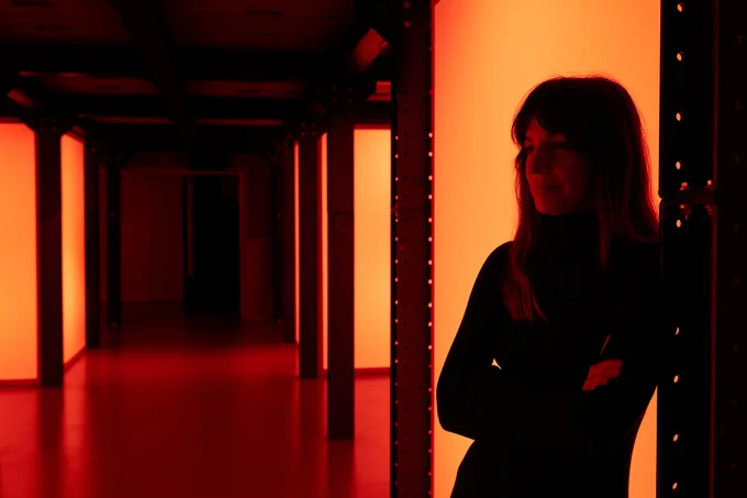 Esmeralda Conde Ruiz, standing in her final presentation on her Schaufler Residency@TU Dresden 2023: the audiovisual installation "24/7" in the orchestra pit of HELLERAU, Apr-May 2023, Photo: Mischa Haller
