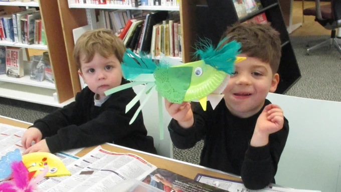boys with colourful crafted birds