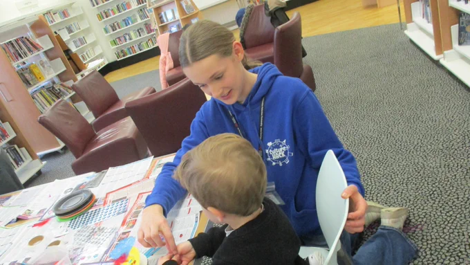 young volunteer helping with activity