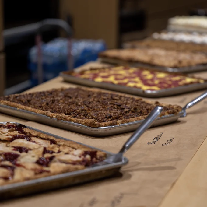 Multiple trays of desserts.