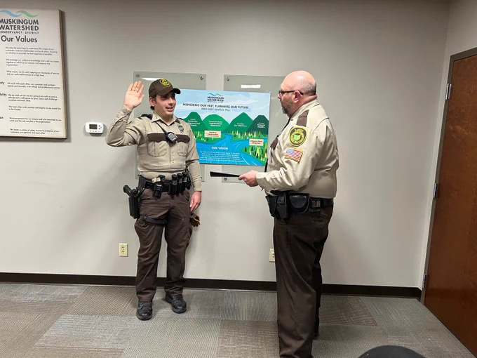 Ranger Dunnivan (left) is with Chief Ranger Patrick Brockmeier (right) during his swearing in ceremony.