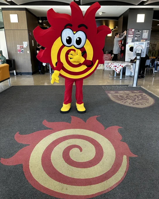Flare covers its mouth and points down at another fireball on the ground