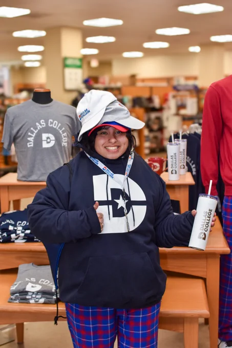 Student wearing a lot of dallas college merchandise