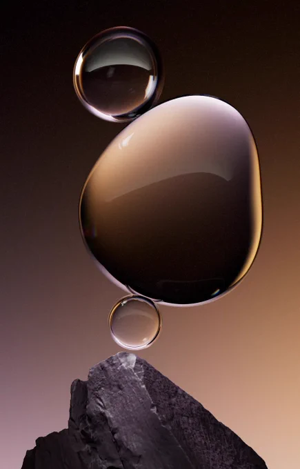 Three black bubbles floating above a rock formation with light emanating from the bottom right