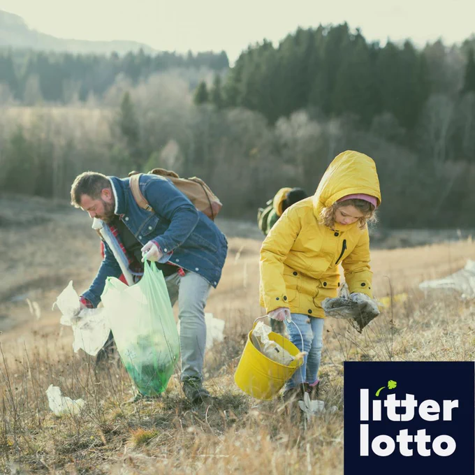 Image shows a father and child litter picking, with the Litter Lotto logo 