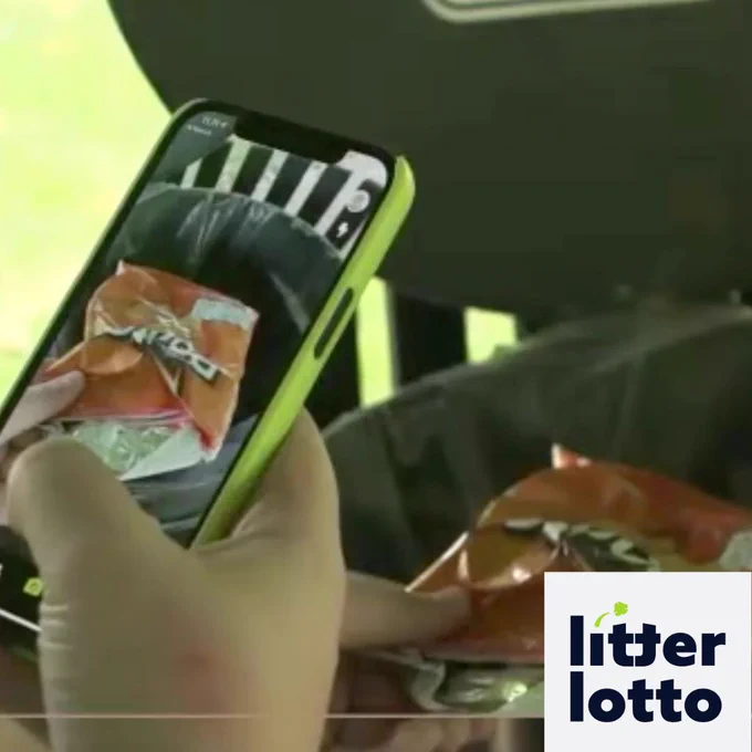 Image shows a hand taking a picture of some litter using the the litter lotto app and the Litter Lotto logo