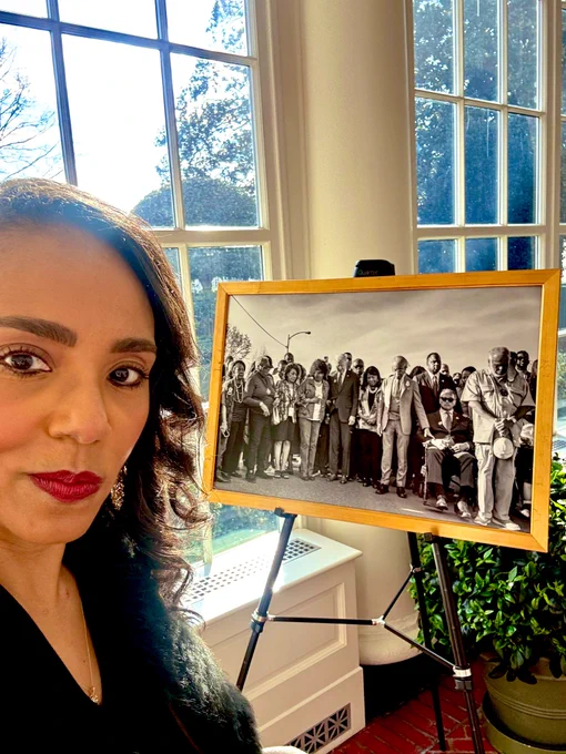 Beautiful Black woman reflecting on the Civil Rights Movement at The White House.