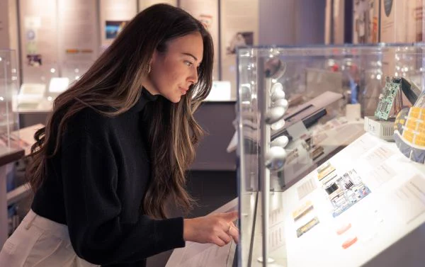 Visitor examining a display in CHM's Revolution exhibit