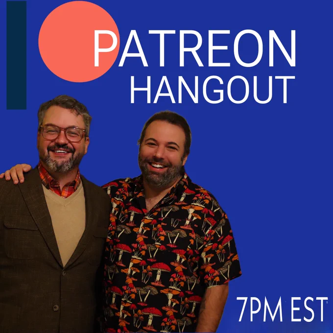 On a royal blue background is the hangout information in white text: Patreon Hangout at 7 pm est on the left side Joseph has his right arm around Jeffrey's shoulder. Jeffrey is wearing a black suit jacket with a sand colored sweater and Joseph is wearing a black button up short sleeve shirt covered in mushrooms with orange tops and off-white trunks. Both are smiling and looking at the camera.