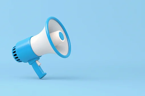 A white and blue megaphone against a blue background.