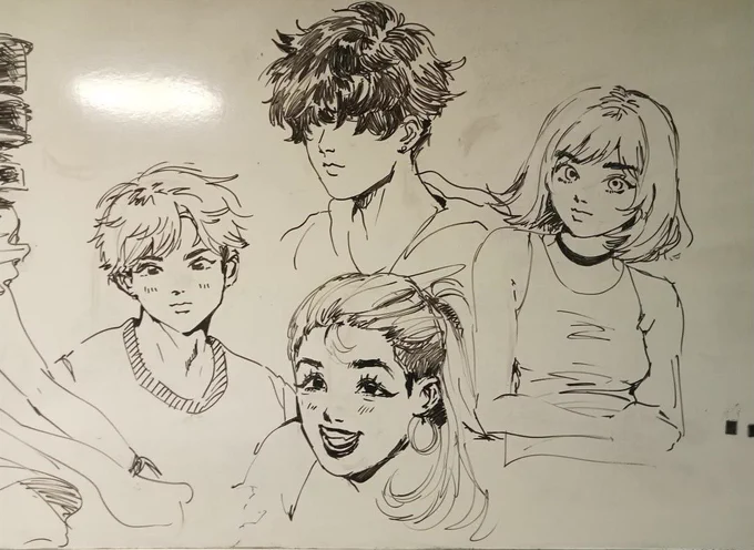 Image of an artist's Manga-style drawing of various people on a whiteboard