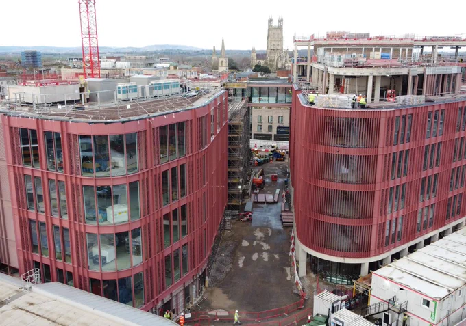 The two Forum buildings with most facade panels installed. The bridge has been installed between the buildings and the cathedral can be seen between the two.

