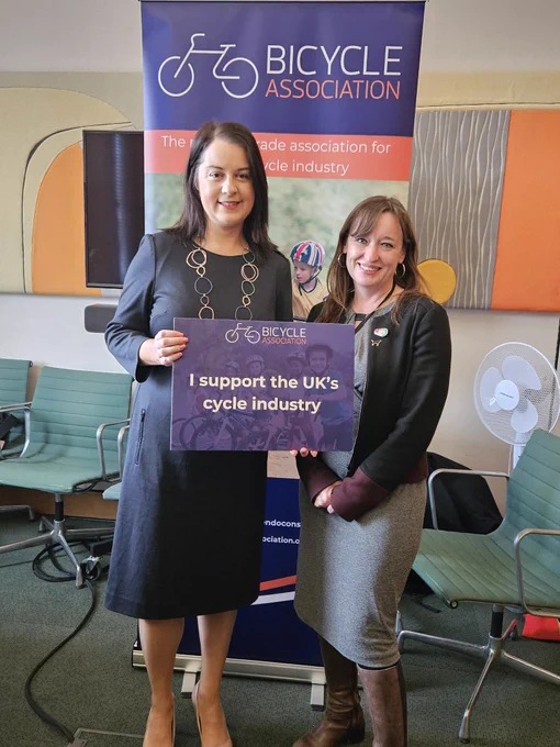 Stephanie Peacock MP & Emily Cherry standing with sign 