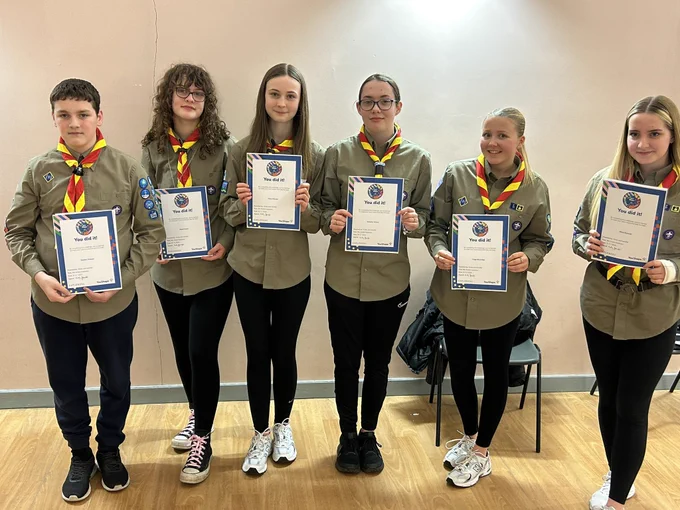 Six scouts holding certificates