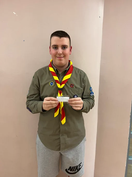 One scout holding his DofE award