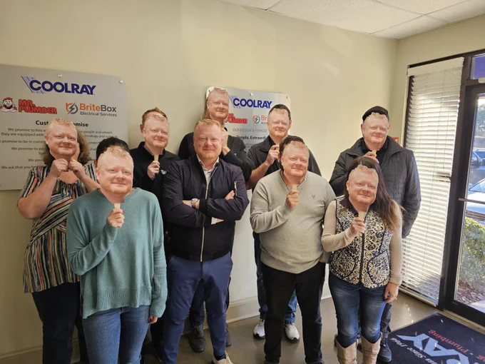 Entire staff with a cutout of Coolray President Tim Smith.