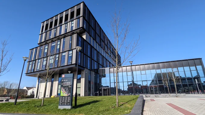 Cardiff University's sbarc/spark building in front of a blue sky. 