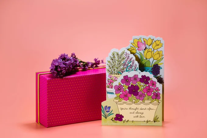A mothers day card alongside a gift box and some lavender