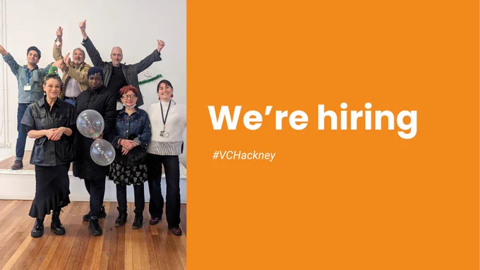 Group of people grinning, holding balloons, and raising their hands in the air. White text on orange background on the right reads, we're hiring